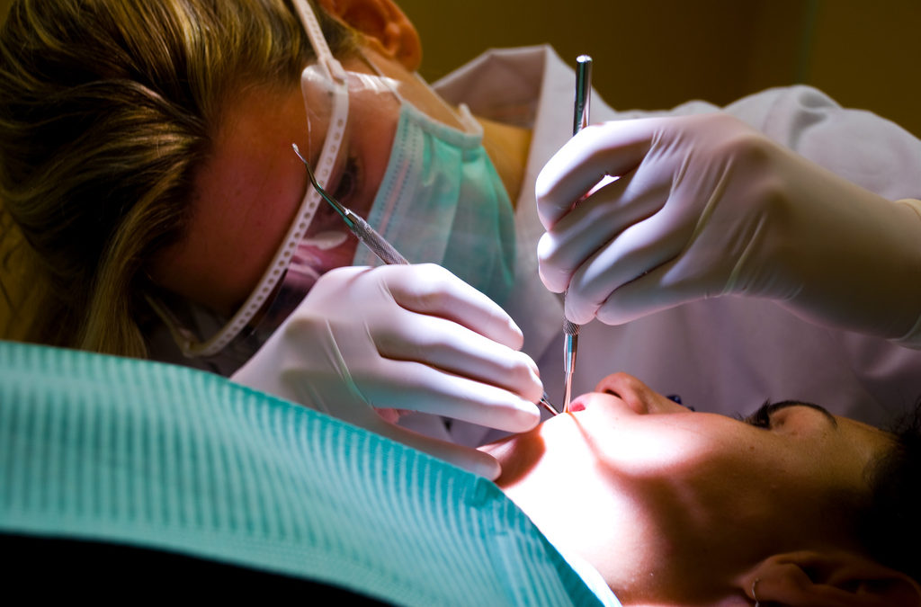 dentist working in a patients mouth